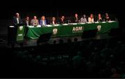 23 July 2022; Gerry McAnaney, FAI president, addresses the assembly alongside the top table, from left, Gary Twohig, FAI director, Joe O'Brien, FAI director, Liz Joyce, FAI independent director, Paul Cooke, FAI vice president, Roy Barrett, FAI independent chairperson, Jonathan Hill, chief executive officer, FAI, Tom Browne, chairman of the FAI's underage committee, Catherine Guy, FAI independent director, Richard Shakespeare, FAI director, and Packie Bonner, chairman of the FAI international and high performance committee, during the annual general meeting of the Football Association of Ireland at the Mansion House in Dublin. Photo by Stephen McCarthy/Sportsfile