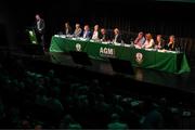 23 July 2022; Jonathan Hill, chief executive officer, FAI, addresses the assembly alongside the top table, from left, Gary Twohig, FAI director, Joe O'Brien, FAI director, Liz Joyce, FAI independent director, Paul Cooke, FAI vice president, Roy Barrett, FAI independent chairperson, Gerry McAnaney, FAI president, FAI, Tom Browne, chairman of the FAI's underage committee, Catherine Guy, FAI independent director, Richard Shakespeare, FAI director, and Packie Bonner, chairman of the FAI international and high performance committee, during the annual general meeting of the Football Association of Ireland at the Mansion House in Dublin. Photo by Stephen McCarthy/Sportsfile