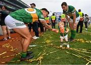 24 July 2022; Micheál Burns, left, celebrates with David Moran, and his son Eli Moran, 18 months, after the GAA Football All-Ireland Senior Championship Final match between Kerry and Galway at Croke Park in Dublin. Photo by Ramsey Cardy/Sportsfile