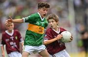 24 July 2022; Josh Furlong, Scoil Naomh Íosaf, Baltinglass, Wicklow, representing Galway, and Donnacha Malone, Scoil Mhuire, Glenties, Donegal, representing Kerry, during the INTO Cumann na mBunscol GAA Respect Exhibition Go Games at GAA All-Ireland Senior Football Championship Final match between Kerry and Galway at Croke Park in Dublin. Photo by Ramsey Cardy/Sportsfile