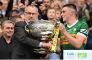24 July 2022; Uachtarán Chumann Lúthchleas Gael Larry McCarthy presents the Sam Maguire Cup to Kerry captain Seán O'Shea after the GAA Football All-Ireland Senior Championship Final match between Kerry and Galway at Croke Park in Dublin. Photo by Stephen McCarthy/Sportsfile