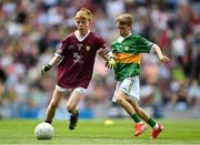 24 July 2022; Oisín Treacy, St Canices Co Ed, Granges Rd, Kilkenny, representing Galway, and Ruairí Collins, St Joseph’s PS, Bessbrook, Armagh, representing Kerry, during the INTO Cumann na mBunscol GAA Respect Exhibition Go Games at GAA All-Ireland Senior Football Championship Final match between Kerry and Galway at Croke Park in Dublin. Photo by Stephen McCarthy/Sportsfile