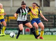 24 July 2022; Tara Berrigan of Whitehall Rangers in action against Alison O'Connell of Douglas Hall during the FAI Women’s Intermediate Cup Final 2022 match between Douglas Hall LFC and Whitehall Rangers at Turners Cross in Cork. Photo by Michael P Ryan/Sportsfile