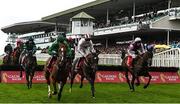 25 July 2022; A general view as runners and riders jump a hurdle during TheGalmont.com & Galwaybayhotel.com Novice Hurdle during day one of the Galway Races Summer Festival at Ballybrit Racecourse in Galway. Photo by Harry Murphy/Sportsfile