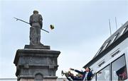 25 July 2022; Tadhg Morley tries to throw a Kerry hat on a statue during the homecoming celebrations of the All-Ireland Senior Football Champions Kerry in Tralee, Kerry. Photo by Piaras Ó Mídheach/Sportsfile