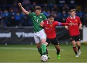 25 July 2022; Jack Patterson of Northern Ireland in action against Dan Gore of Manchester United during the SuperCupNI match between Northern Ireland and Manchester United at Coleraine Showgrounds in Coleraine, Derry. Photo by Ramsey Cardy/Sportsfile
