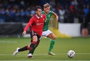 25 July 2022; James Nolan of Manchester United in action against Sean Brown of Northern Ireland during the SuperCupNI match between Northern Ireland and Manchester United at Coleraine Showgrounds in Coleraine, Derry. Photo by Ramsey Cardy/Sportsfile