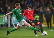 25 July 2022; Ruben Curley of Manchester United in action against Jack Patterson of Northern Ireland during the SuperCupNI match between Northern Ireland and Manchester United at Coleraine Showgrounds in Coleraine, Derry. Photo by Ramsey Cardy/Sportsfile