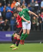 25 July 2022; Ordhan McCart of Northern Ireland in action against Manni Norkett of Manchester United during the SuperCupNI match between Northern Ireland and Manchester United at Coleraine Showgrounds in Coleraine, Derry. Photo by Ramsey Cardy/Sportsfile