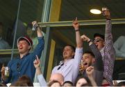 26 July 2022; Galway players including Billy Mannion, left, and Kieran Molloy celebrate as Galway manager Padraic Joyce's horse Chavajod finishes last in the caulfieldindustrial.com Handicap during day two of the Galway Races Summer Festival at Ballybrit Racecourse in Galway. Photo by Harry Murphy/Sportsfile