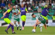 26 July 2022; Andy Lyons of Shamrock Rovers is fouled by Manuel Cafumana of Ludogorets during the UEFA Champions League 2022-23 Second Qualifying Round Second Leg match between Shamrock Rovers and Ludogorets at Tallaght Stadium in Dublin. Photo by Ramsey Cardy/Sportsfile