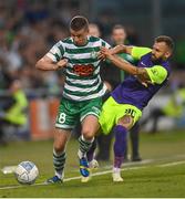 26 July 2022; Ronan Finn of Shamrock Rovers is tackled by Spas Delev of Ludogorets during the UEFA Champions League 2022-23 Second Qualifying Round Second Leg match between Shamrock Rovers and Ludogorets at Tallaght Stadium in Dublin. Photo by Ramsey Cardy/Sportsfile