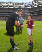 24 July 2022; Bernard Óg Keaney, St. Caillín's National School, Aillebrack, Galway, presents the match ball to referee Seán Hurson before the GAA Football All-Ireland Senior Championship Final match between Kerry and Galway at Croke Park in Dublin. Photo by Ramsey Cardy/Sportsfile