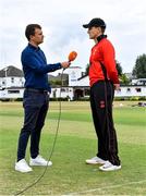 27 July 2022; PJ Moor of Munster Reds is interviewed by commentator Andrew Blair White of HBV Studios before the Cricket Ireland Inter-Provincial Trophy match between Leinster Lightning and Munster Reds at Pembroke Cricket Club in Dublin. Photo by Piaras Ó Mídheach/Sportsfile