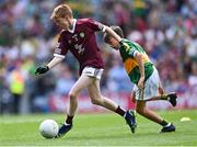 24 July 2022; Oisín Treacy, St Canices Co Ed, Granges Rd, Kilkenny, representing Galway, in action against Conor O' Brien, St. Pius X BNS, Terenure, Dublin, representing Kerry, during the INTO Cumann na mBunscol GAA Respect Exhibition Go Games at GAA All-Ireland Senior Football Championship Final match between Kerry and Galway at Croke Park in Dublin. Photo by Piaras Ó Mídheach/Sportsfile