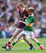 24 July 2022; Oisín Treacy, St Canices Co Ed, Granges Rd, Kilkenny, representing Galway, in action against Ruairí Collins, St Joseph’s PS, Bessbrook, Armagh, representing Kerry, during the INTO Cumann na mBunscol GAA Respect Exhibition Go Games at GAA All-Ireland Senior Football Championship Final match between Kerry and Galway at Croke Park in Dublin. Photo by Piaras Ó Mídheach/Sportsfile