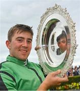27 July 2022; Jockey Jordan Gainford with the trophy after winning the Tote Galway Plate on Hewick during day three of the Galway Races Summer Festival at Ballybrit Racecourse in Galway. Photo by Seb Daly/Sportsfile