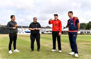 28 July 2022; Munster Red's captain PJ Moor makes the toss, watched by, from left, HBV studios commentator Andrew Blair White, match  referee Phil Thompson and Northern Knights captain Mark Adair during the Cricket Ireland Inter-Provincial Trophy match between Munster Reds and Northern Knights at Pembroke Cricket Club in Dublin. Photo by Sam Barnes/Sportsfile