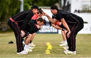 28 July 2022; Munster Reds players warm up before the Cricket Ireland Inter-Provincial Trophy match between Munster Reds and Northern Knights at Pembroke Cricket Club in Dublin. Photo by Sam Barnes/Sportsfile