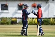 28 July 2022; John Matchett of Northern Knights, left, celebrates with team-mate James McCollum after bringing up his half century during the Cricket Ireland Inter-Provincial Trophy match between Munster Reds and Northern Knights at Pembroke Cricket Club in Dublin. Photo by Sam Barnes/Sportsfile