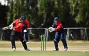28 July 2022; David Delany of Munster Reds plays a shot watched by  Northern Knights wicketkeeper Neil Rock during the Cricket Ireland Inter-Provincial Trophy match between Munster Reds and Northern Knights at Pembroke Cricket Club in Dublin. Photo by Sam Barnes/Sportsfile