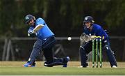 28 July 2022; Simi Singh of Leinster Lightning plays a shot watched by North West Warriors wicketkeeper Stephen Doheny during the Cricket Ireland Inter-Provincial Trophy match between Leinster Lightning and North West Warriors at Pembroke Cricket Club in Dublin. Photo by Sam Barnes/Sportsfile