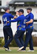 28 July 2022; Shane Getkate of North West Warriors, right, celebrates with team-mates after catching out Andrew Balbirnie of Leinster Lightning during the Cricket Ireland Inter-Provincial Trophy match between Leinster Lightning and North West Warriors at Pembroke Cricket Club in Dublin. Photo by Sam Barnes/Sportsfile