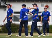 28 July 2022; Shane Getkate of North West Warriors, second from right, celebrates with team-mates, after catching out Andrew Balbirnie of Leinster Lightning during the Cricket Ireland Inter-Provincial Trophy match between Leinster Lightning and North West Warriors at Pembroke Cricket Club in Dublin. Photo by Sam Barnes/Sportsfile