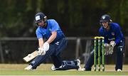 28 July 2022; Andrew Balbirnie of Leinster Lightning plays a shot watched by North West Warriors wicketkeeper Stephen Doheny during the Cricket Ireland Inter-Provincial Trophy match between Leinster Lightning and North West Warriors at Pembroke Cricket Club in Dublin. Photo by Sam Barnes/Sportsfile