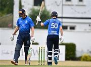 28 July 2022; George Dockrell of Leinster Lightning, right, acknowledges his team-mates after bringing up his half century during the Cricket Ireland Inter-Provincial Trophy match between Leinster Lightning and North West Warriors at Pembroke Cricket Club in Dublin. Photo by Sam Barnes/Sportsfile
