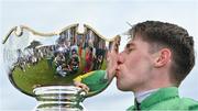 28 July 2022; Jockey Liam McKenna kisses with the trophy after riding Tudor City to victory in the Guinness Galway Hurdle Handicap during day four of the Galway Races Summer Festival at Ballybrit Racecourse in Galway. Photo by Seb Daly/Sportsfile