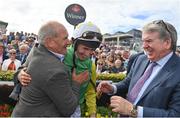 28 July 2022; Trainer Tony Martin, left, jockey Liam McKenna, centre, and owner John Breslin celebrate after sending out Tudor City to win the Guinness Galway Hurdle Handicap during day four of the Galway Races Summer Festival at Ballybrit Racecourse in Galway. Photo by Seb Daly/Sportsfile