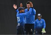 28 July 2022; Simi Singh of Leinster Lightning celebrates with team-mate George Dockrell after catching out Stephen Doheny of North West Warriors during the Cricket Ireland Inter-Provincial Trophy match between Leinster Lightning and North West Warriors at Pembroke Cricket Club in Dublin. Photo by Sam Barnes/Sportsfile