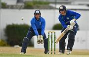 28 July 2022; Shane Getkate of North West Warriors plays a shot watched by Leinster Lightning wicketkeeper Lorcan Tucker during the Cricket Ireland Inter-Provincial Trophy match between Leinster Lightning and North West Warriors at Pembroke Cricket Club in Dublin. Photo by Sam Barnes/Sportsfile