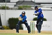 28 July 2022; Stephen Doheny of North West Warriors plays a shot watched by Leinster Lightning wicketkeeper Lorcan Tucker during the Cricket Ireland Inter-Provincial Trophy match between Leinster Lightning and North West Warriors at Pembroke Cricket Club in Dublin. Photo by Sam Barnes/Sportsfile