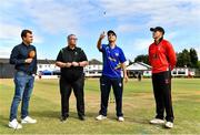 29 July 2022; North West Warriors captain Andy McBrine makes the toss, alongside, from left, HBV studios commentator Andrew Blair White, Match Referee Phil Thomson and Munster Reds captain PJ Moor before the Cricket Ireland Inter-Provincial Trophy match between North West Warriors and Munster Reds at Pembroke Cricket Club in Dublin. Photo by Sam Barnes/Sportsfile