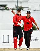 29 July 2022; Munster Reds wicketkeeper PJ Moor, left, is congratulated by team-mate Kevin O'Brien after catching out Nathan McGuire of North West Warriors during the Cricket Ireland Inter-Provincial Trophy match between North West Warriors and Munster Reds at Pembroke Cricket Club in Dublin. Photo by Sam Barnes/Sportsfile