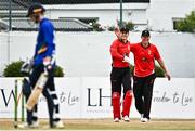 29 July 2022; Munster Reds wicketkeeper PJ Moor, left, is congratulated by team-mate Kevin O'Brien after catching out Nathan McGuire of North West Warriors during the Cricket Ireland Inter-Provincial Trophy match between North West Warriors and Munster Reds at Pembroke Cricket Club in Dublin. Photo by Sam Barnes/Sportsfile