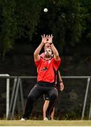 29 July 2022; Tyrone Kane of Munster Reds catches out Shane Getkate of North West Warriors during the Cricket Ireland Inter-Provincial Trophy match between North West Warriors and Munster Reds at Pembroke Cricket Club in Dublin. Photo by Sam Barnes/Sportsfile