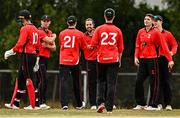 29 July 2022; Tyrone Kane of Munster Reds, centre, celebrates with team-mates after catching out Shane Getkate of North West Warriors during the Cricket Ireland Inter-Provincial Trophy match between North West Warriors and Munster Reds at Pembroke Cricket Club in Dublin. Photo by Sam Barnes/Sportsfile