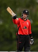 29 July 2022; PJ Moor of Munster Reds acknowledges the crowd after bringing up his half century during the Cricket Ireland Inter-Provincial Trophy match between North West Warriors and Munster Reds at Pembroke Cricket Club in Dublin. Photo by Sam Barnes/Sportsfile
