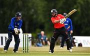 29 July 2022; Tyrone Kane of Munster Reds plays a shot watched by North West Warriors wicketkeeper Stephen Doheny during the Cricket Ireland Inter-Provincial Trophy match between North West Warriors and Munster Reds at Pembroke Cricket Club in Dublin. Photo by Sam Barnes/Sportsfile
