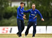 29 July 2022; Scott Macbeth of North West Warriors, left, and team-mate Andy McBrine celebrate the wicket of Curtis Campher of Munster Reds during the Cricket Ireland Inter-Provincial Trophy match between North West Warriors and Munster Reds at Pembroke Cricket Club in Dublin. Photo by Sam Barnes/Sportsfile