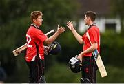 29 July 2022; Munster Reds players Kevin O'Brien, left, and Gareth Delany, celebrate after their side's victory in the Cricket Ireland Inter-Provincial Trophy match between North West Warriors and Munster Reds at Pembroke Cricket Club in Dublin. Photo by Sam Barnes/Sportsfile