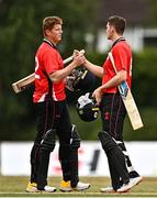 29 July 2022; Munster Reds players Kevin O'Brien, left, and Gareth Delany, celebrate after their side's victory in the Cricket Ireland Inter-Provincial Trophy match between North West Warriors and Munster Reds at Pembroke Cricket Club in Dublin. Photo by Sam Barnes/Sportsfile