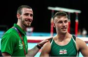 29 July 2022; Ewan McAteer of Northern Ireland with coach Conor McGovern after competing in the men's vault qualification at Arena Birmingham in Birmingham, England. Photo by Paul Greenwood/Sportsfile