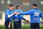 29 July 2022; Tim Tector of Leinster Lightning, centre, is congratulated by team-mates Mike O'Reilly, left and Greg Ford after catching out Paul Stirling of Northern Knights during the Cricket Ireland Inter-Provincial Trophy match between Northern Knights and Leinster Lightning at Pembroke Cricket Club in Dublin. Photo by Sam Barnes/Sportsfile