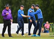 29 July 2022; Leinster Lightning players Mike O'Reilly, left, and George Dockrell, celebrate the wicket of John Matchett of Northern Knights during the Cricket Ireland Inter-Provincial Trophy match between Northern Knights and Leinster Lightning at Pembroke Cricket Club in Dublin. Photo by Sam Barnes/Sportsfile