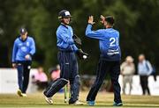29 July 2022; Simi Singh of Leinster Lightning, right, and team-mate Lorcan Tucker celebrate the wicket of Neil Rock of Northern Knights during the Cricket Ireland Inter-Provincial Trophy match between Northern Knights and Leinster Lightning at Pembroke Cricket Club in Dublin. Photo by Sam Barnes/Sportsfile