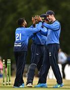 29 July 2022; Simi Singh of Leinster Lightning, left, and team-mate  George Dockrell celebrate the wicket of Neil Rock of Northern Knights during the Cricket Ireland Inter-Provincial Trophy match between Northern Knights and Leinster Lightning at Pembroke Cricket Club in Dublin. Photo by Sam Barnes/Sportsfile
